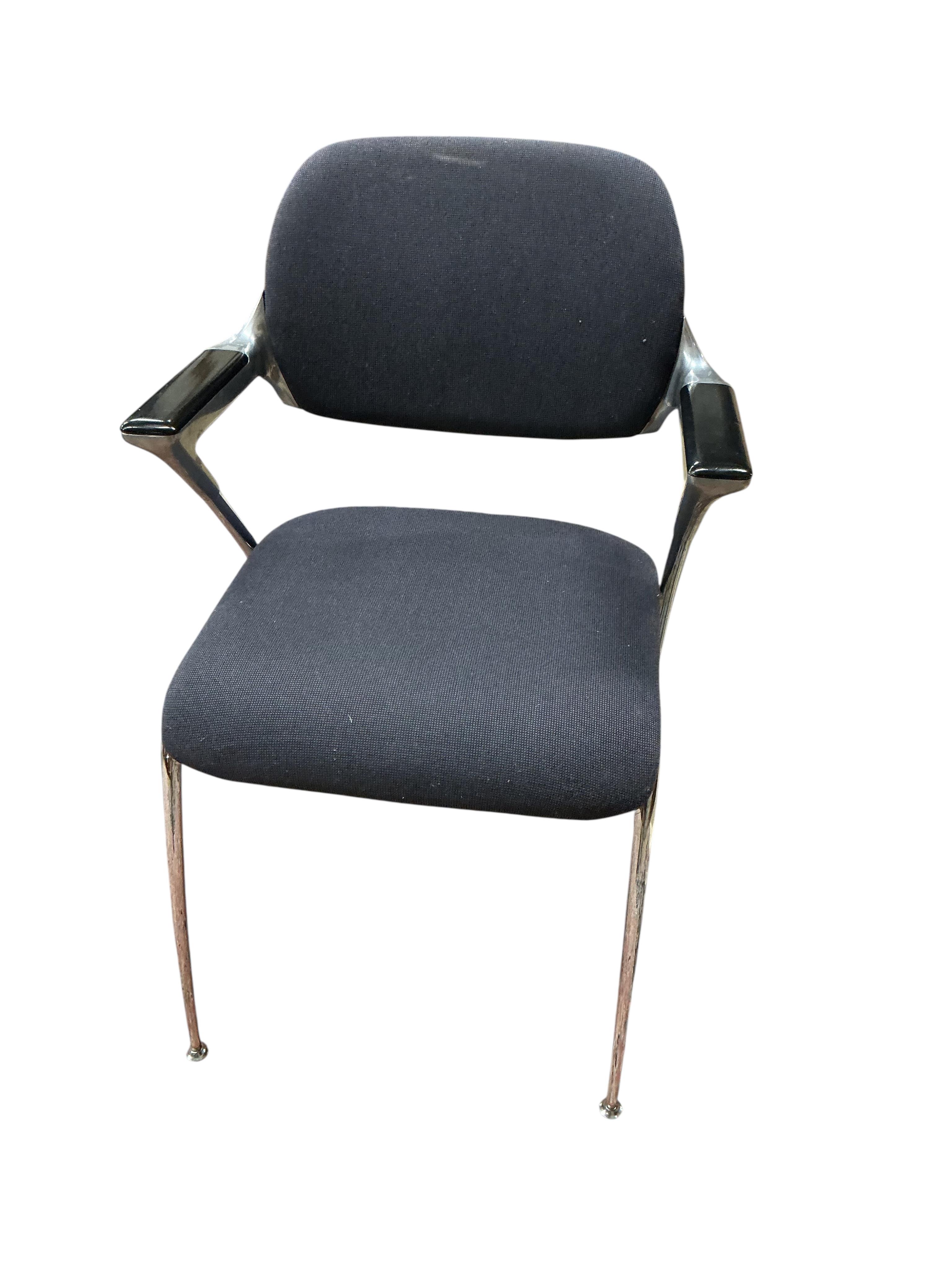 A set of four Brunner mid century upholstered chrome elbow chairs
